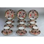 Crown Derby imari pattern, set of nine cups and saucers, three tea plates.