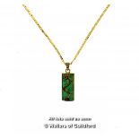 Jade rectangular pendant with a dragon design, on a gold coloured chain