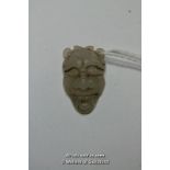 A Chinese hardstone pendant carved as a face, 3cm.