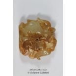 A Chinese hardstone pendant carved as a dragon.