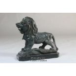 A carved black marble lion, 10cm.