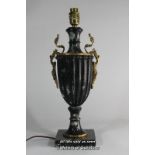 A black marble table lamp with gilt metal mounts, 41cm including fitting.