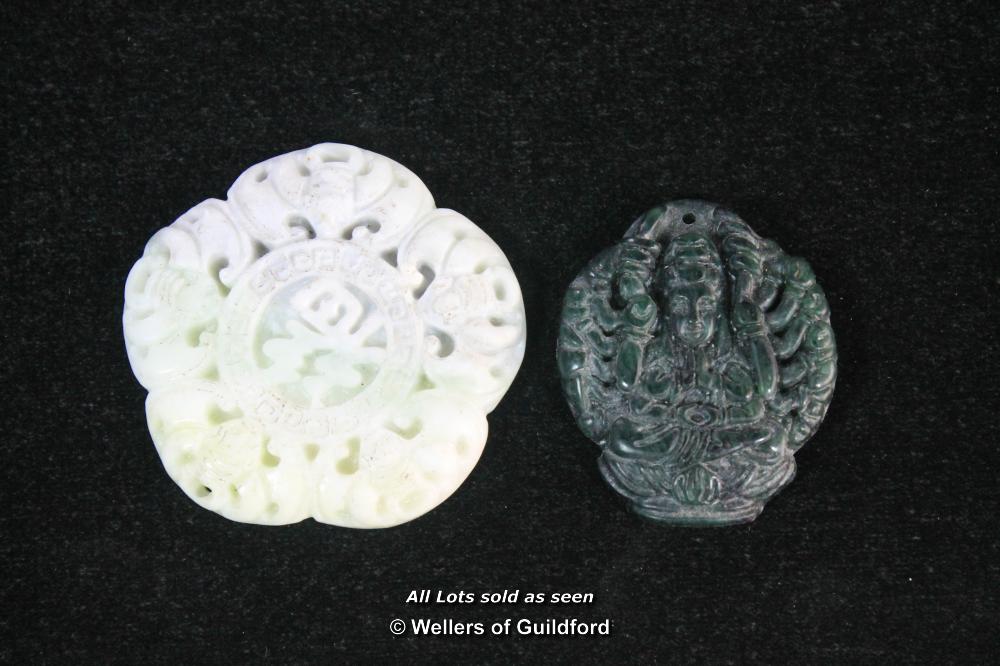 Two Chinese carved hardstone pendants.