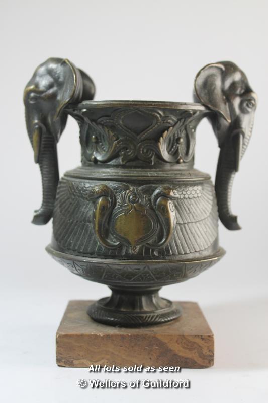 An eastern bronze vase with elephant head handles, marble base, 21cm.