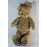A large straw stuffed teddy bear with jointed arms and legs, 70cm.