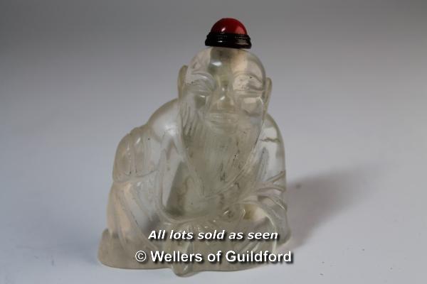 A Chinese crystal snuff bottle carved as a seated sage.