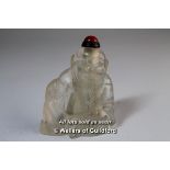 A Chinese crystal snuff bottle carved as a seated sage.