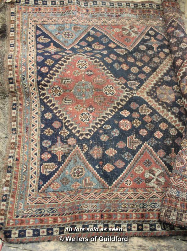 Persian wool rug, multiple borders and central medallions, 63cm wide.