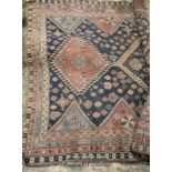 Persian wool rug, multiple borders and central medallions, 63cm wide.