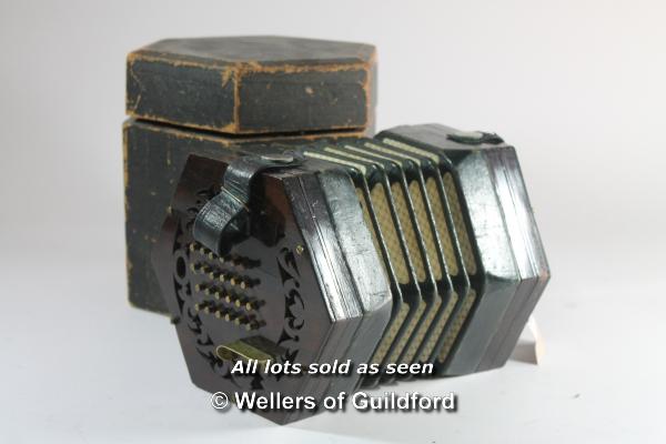 A 48 button concertina in original hexagonal box, un-named.