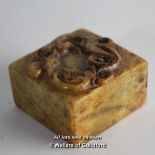 A Chinese small square hardstone seal, carved dragon to top, 2.75cm.