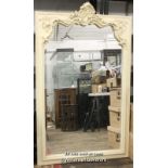 A large modern antique style cream framed mirror with ornate scrolling frame and bevelled plate, 170