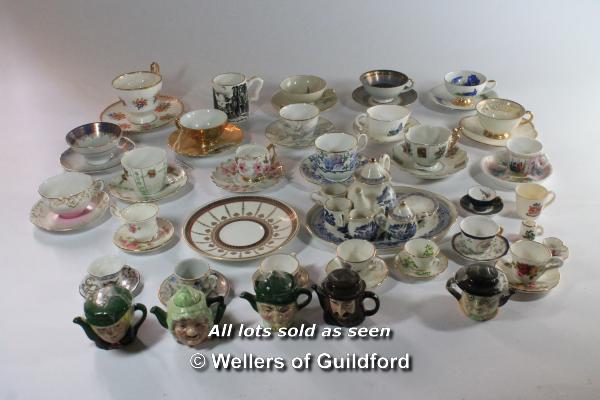 A quantity of mostly miniature cups and saucers; six Artone miniature teapots; a blue and white