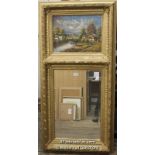 A 20th Century trumeau mirror, the painted panel depicting a rural village by a lake, bevelled