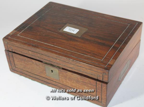 A Victorian rosewood box with inset brass plaque and military style brass handles, 30cm wide.