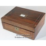 A Victorian rosewood box with inset brass plaque and military style brass handles, 30cm wide.