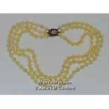 *Three row pearl choker necklace, with 9ct yellow gold clasp set with amethysts and small pearls (