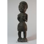 A West African carved wooden fetish figure,26cm.