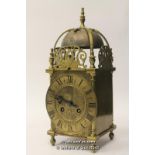 A French brass lantern clock, brass dial with Roman numerals and two train movement, the back