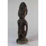 A carved wooden African tribal figure, 26cm.