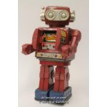 Rotate-O-Matic Super Astronaut Robot circa 1960s, battery operated with tin plate opening chest,