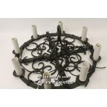 A modern wrought iron gothic style chandelier