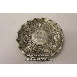 A Chinese white metal dish signed Wai-Kee Silver, depicting signs of the zodiac.