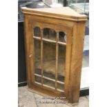 Pitch pine hanging corner cabinet with glazed door enclosing shelves, 89cm