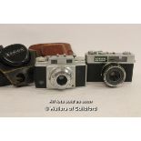 Konica EE Matic deluxe camera; Agfa Solinar camera, both in leather cases.