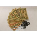 Seventeen old Chinese coins and ten banknotes.