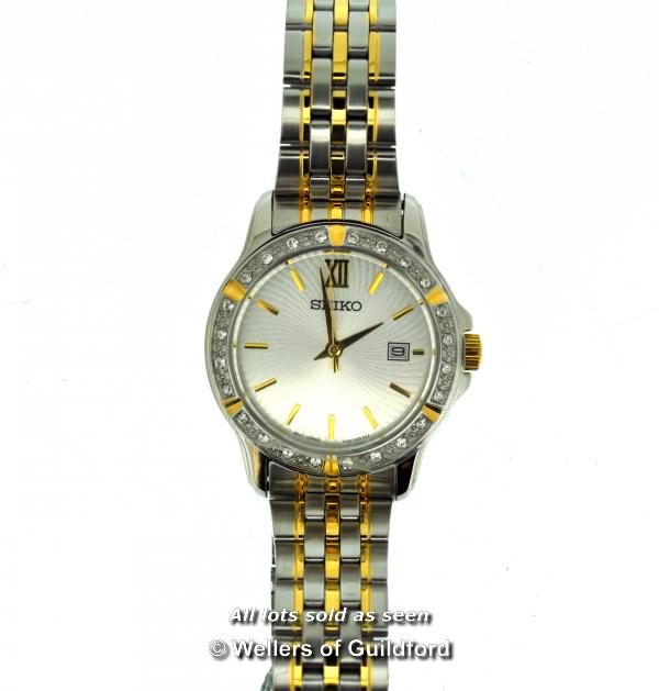 *Ladies' Seiko wristwatch, circular cream textured dial, with baton hour markers, date aperture