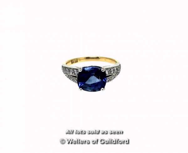 Sapphire and diamond ring, central cushion cut blue sapphire weighing an estimated 3.00cts, four