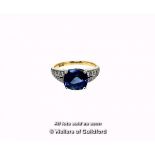 Sapphire and diamond ring, central cushion cut blue sapphire weighing an estimated 3.00cts, four