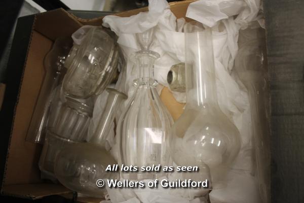 A small quantity of glassware to include oil lamp chimneys, and decanters (9)