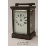 A French brass carriage clock with white enamel dial, Roman numerals, striking on a gong, 15cm
