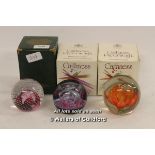 Two boxed Caithness paperweights: Bewitched and Cauldron; a further unsigned paperweight.