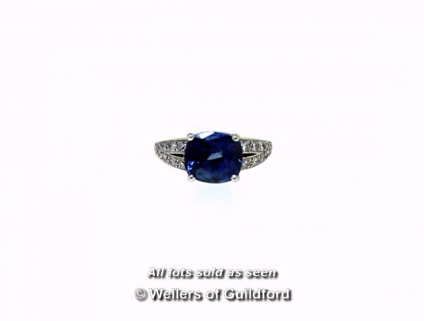 Sapphire and diamond ring, central cushion cut blue sapphire weighing an estimated 3.00cts, four - Image 2 of 4