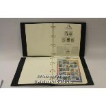 Two stamp albums containing Birds of the World and Aviation Heritage collections.