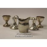 A small silver jug, Chester; pair of modern silver dwarf candlesticks; pair of silver plated egg