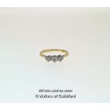 Three stone diamond ring, three round brilliant cut diamonds mounted in white metal stamped as