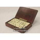 A small mahogany box stamped 'Siemens electric lamps' containing a set of 28 tiny dominoes, the