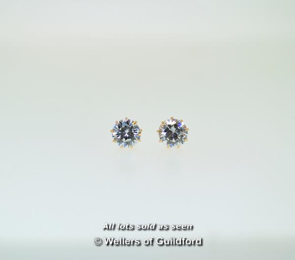 Pair of white cubic zirconia solitaire ear studs, mounted in 9ct yellow gold (non-gold butterflies)