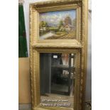 A 20th Century trumeau mirror, the painted panel depicting a rural village by a lake, bevelled