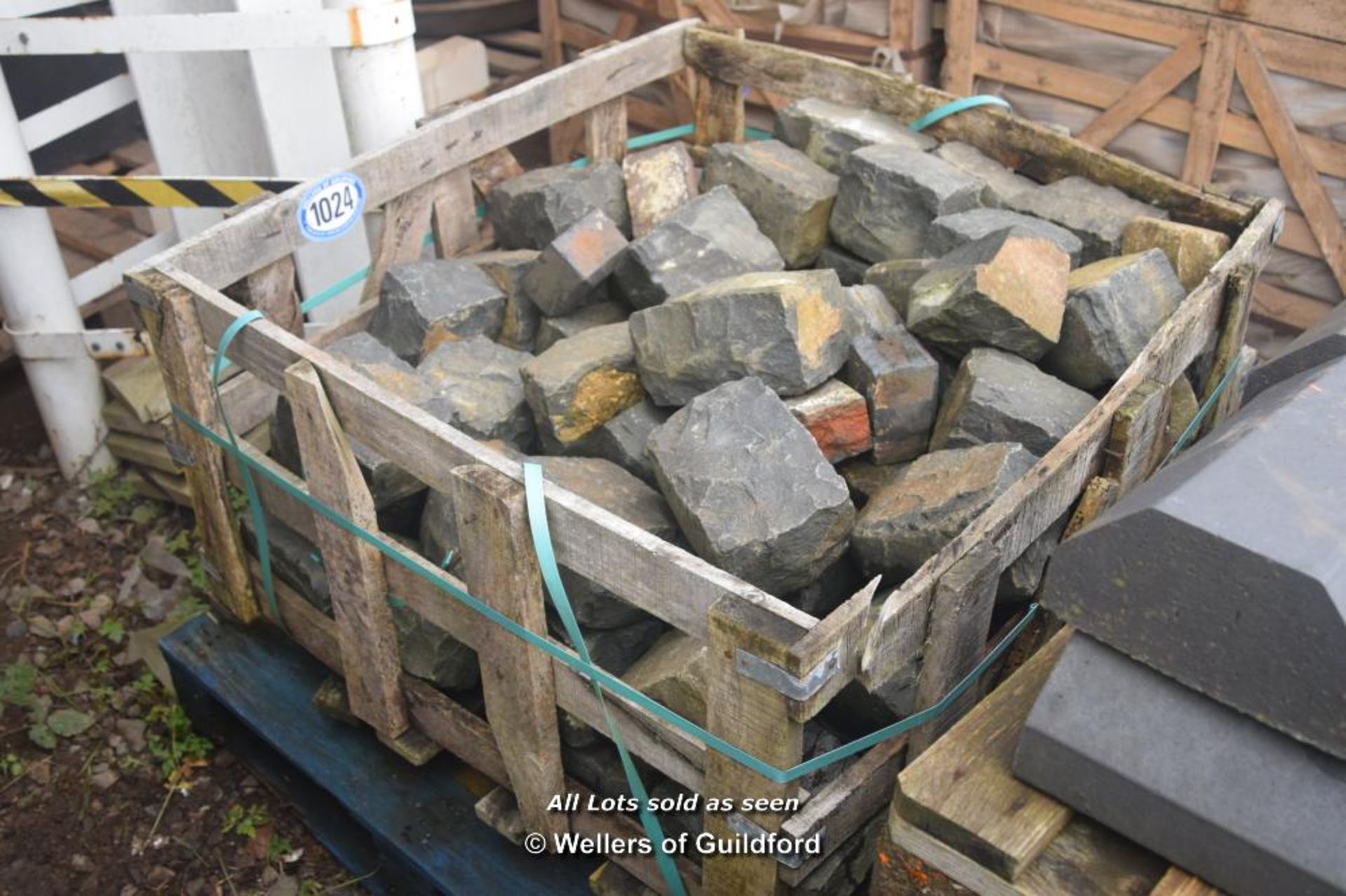 *CRATE CONTAINING BLACK GRANITE SETTS