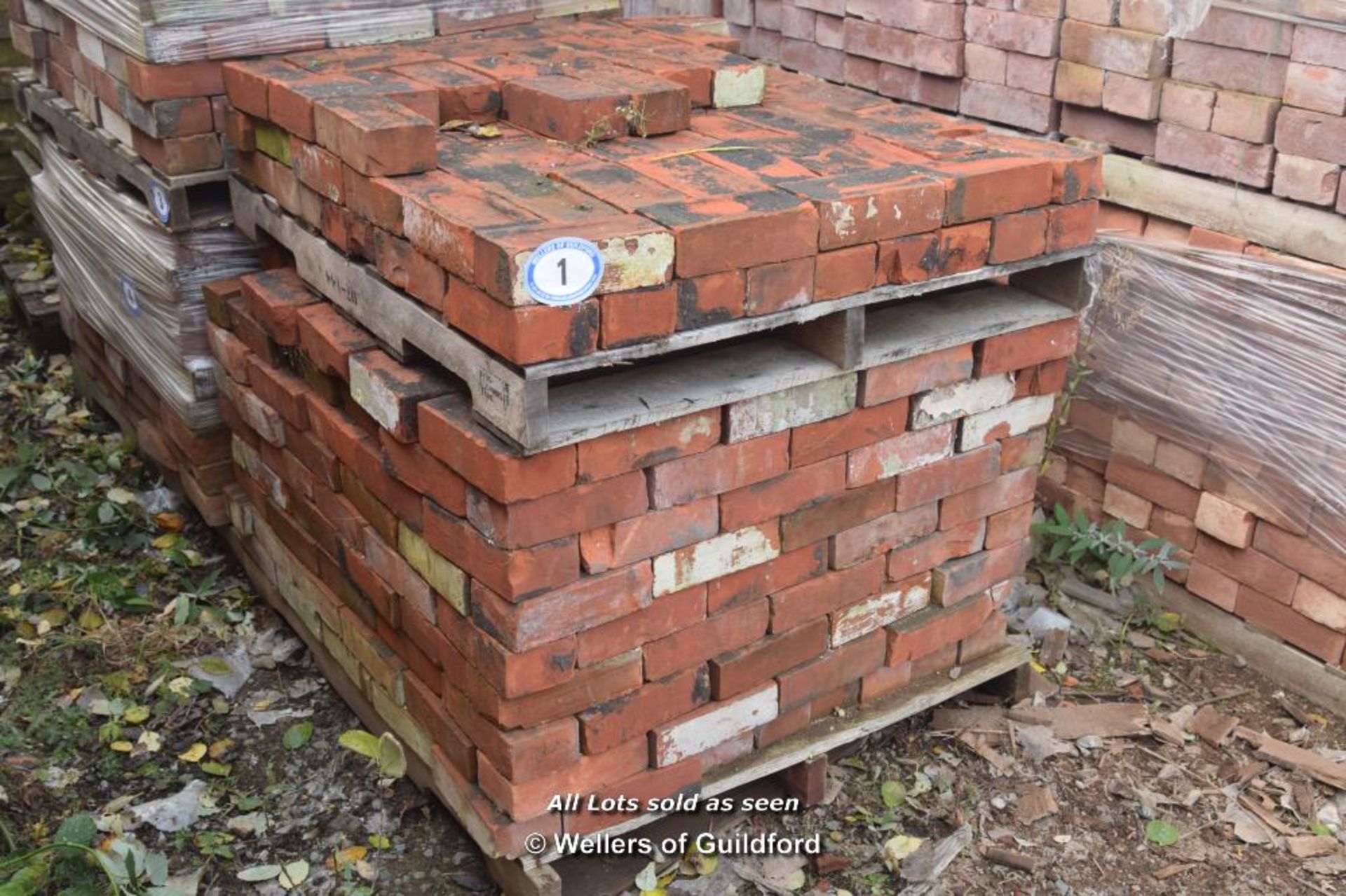 *ONE AND A HALF PALLETS OF APPROX FIVE HUNDRED RED BRICKS, 9" X 2 3/4"