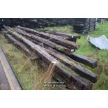 *LARGE BUNDLE OF LONG OAK BEAMS IN EXCESS OF FIVE METRES LONG