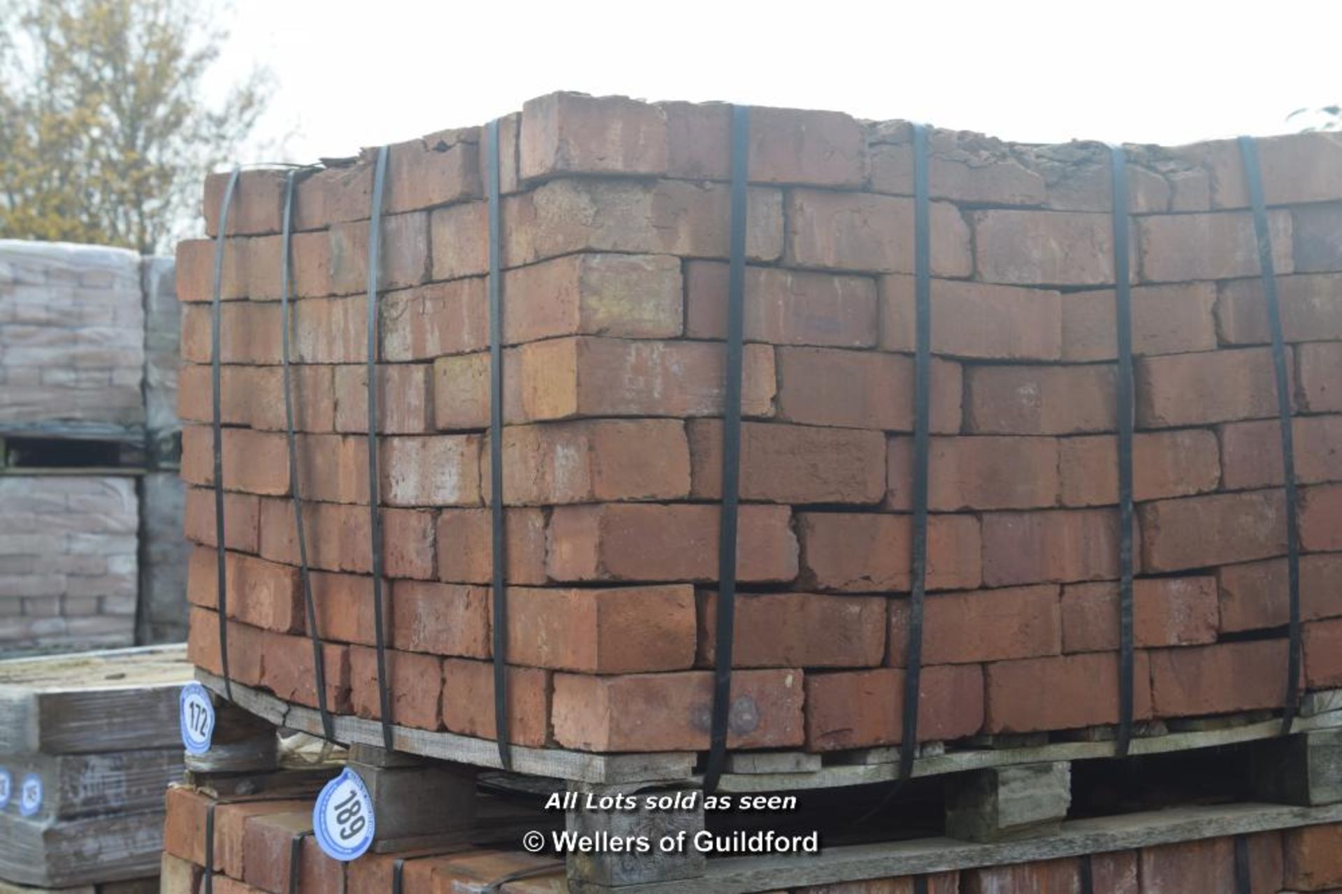 *PALLET OF APPROX THREE HUNDRED RED BRICKS APPROX SIZE 215MM X 75MM