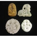 Four Chinese hardstone pendants.