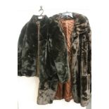 A long brown fake fur coat; fake fur black jacket. (2)