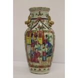 A Cantonese baluster vase with fluted rim and twin handles, 24cm.